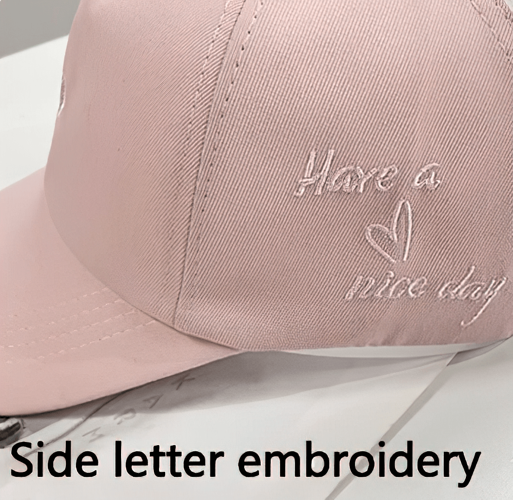 Stylish pink baseball cap with 'Have a nice day' letter embroidery for a trendy touch.